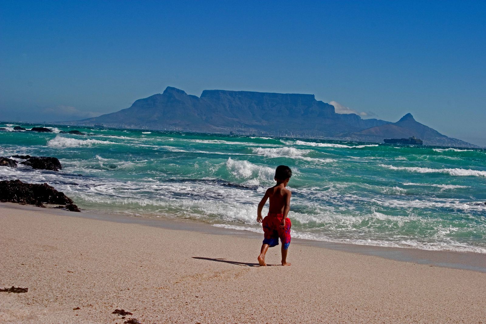 Table Mountain's flat summit rising above Cape Town seen across Table Bay from Blouberg