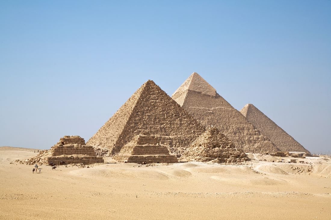 The three main pyramids of Giza rising above the desert plateau